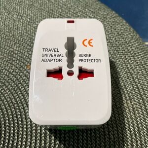 Travel Universal Adaptor - White and Red, in like new condition.
